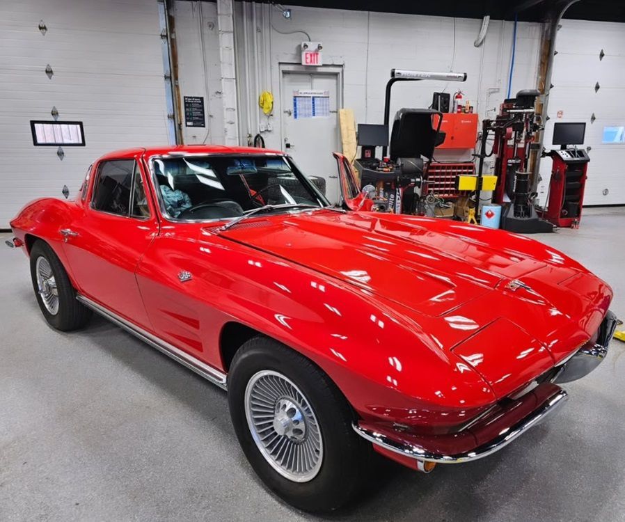 A classic red Corvette Stingray parked in our auto shop in Ancaster for service
