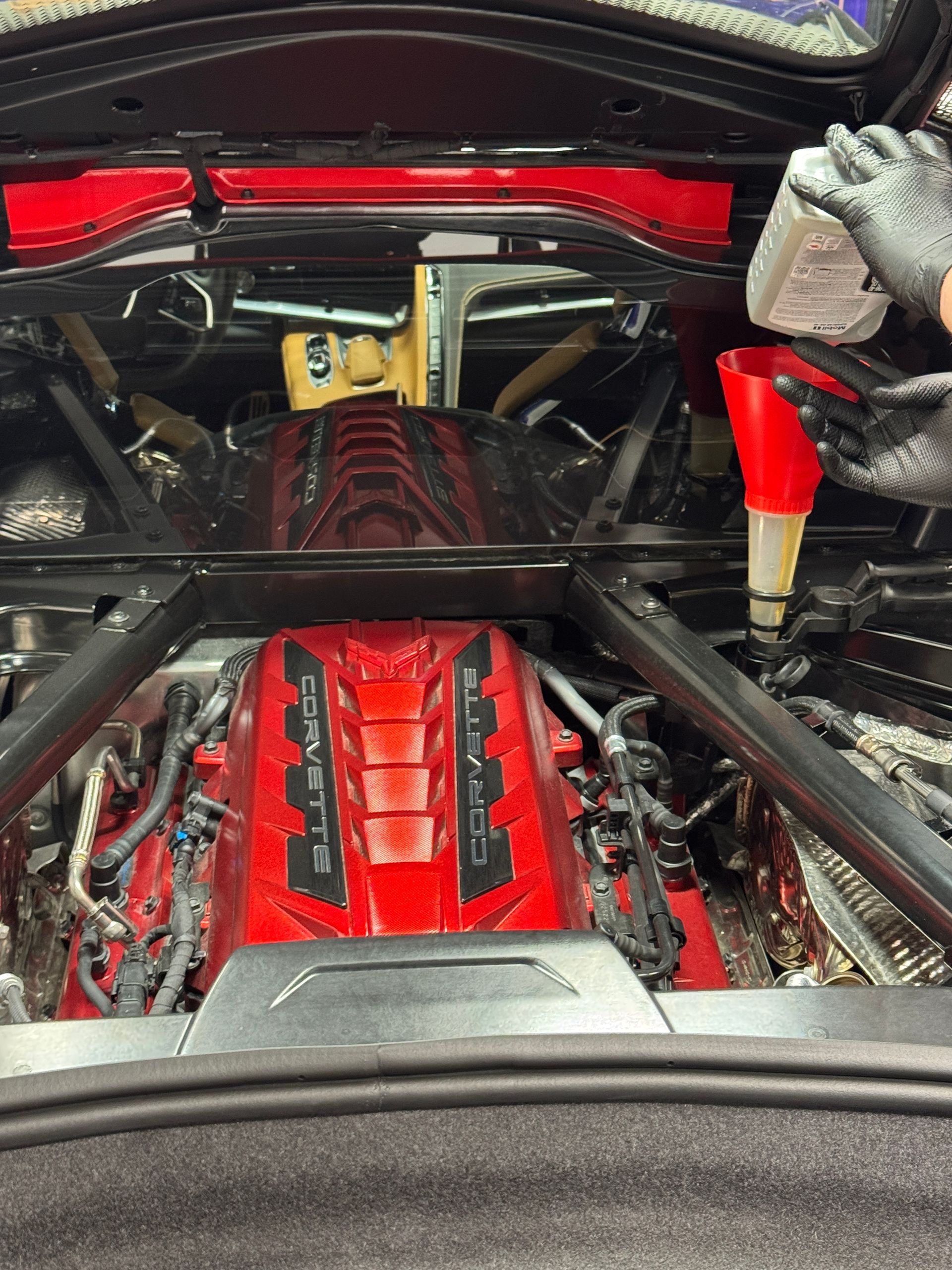 A Corvette getting new synthetic oil at Village Auto Service