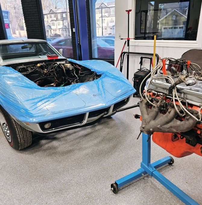 Blue supercar parked in Village Auto Service for an engine swap