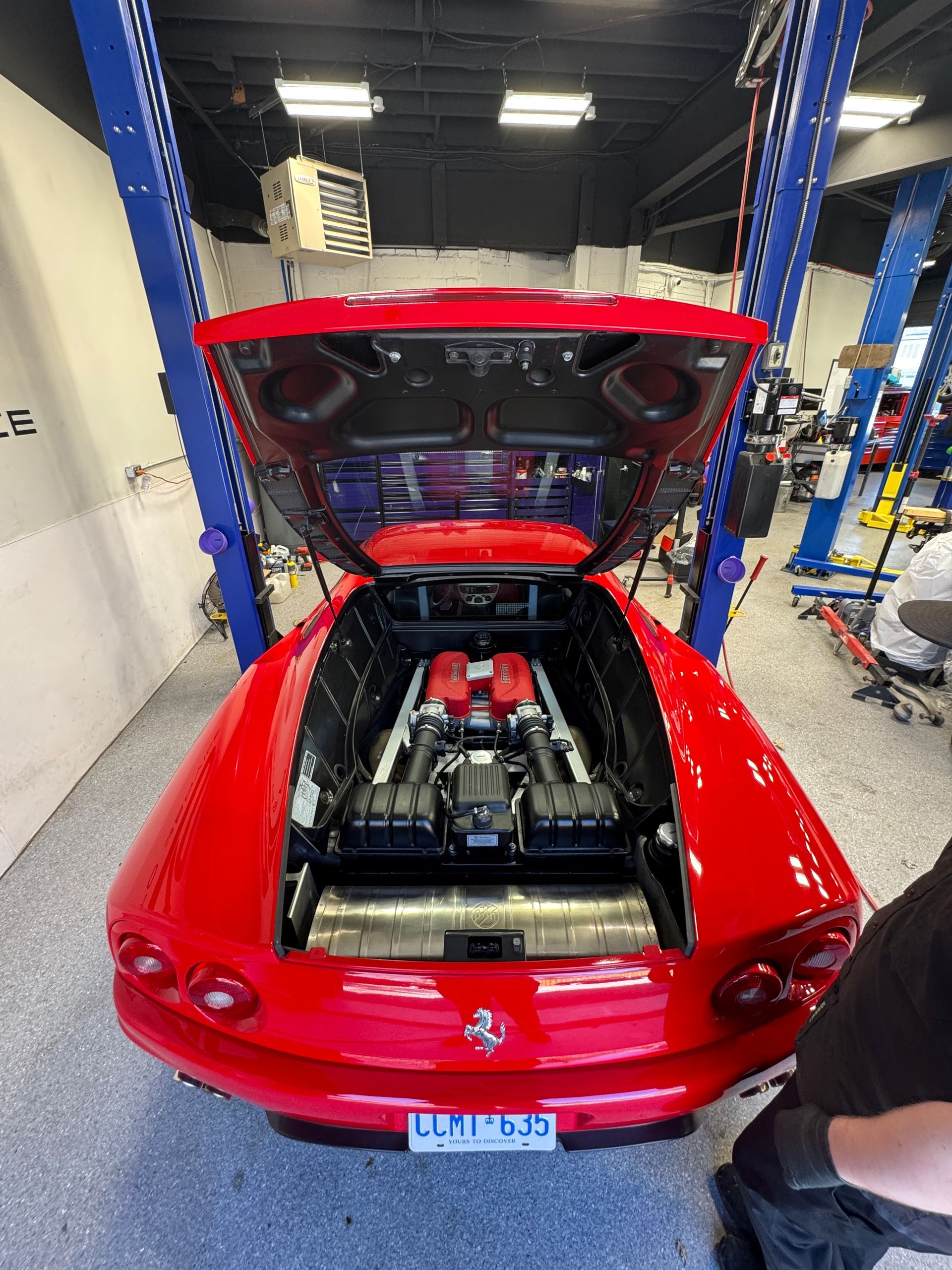A red Ferrari in in our shop for diagnostics and mechanical repairs