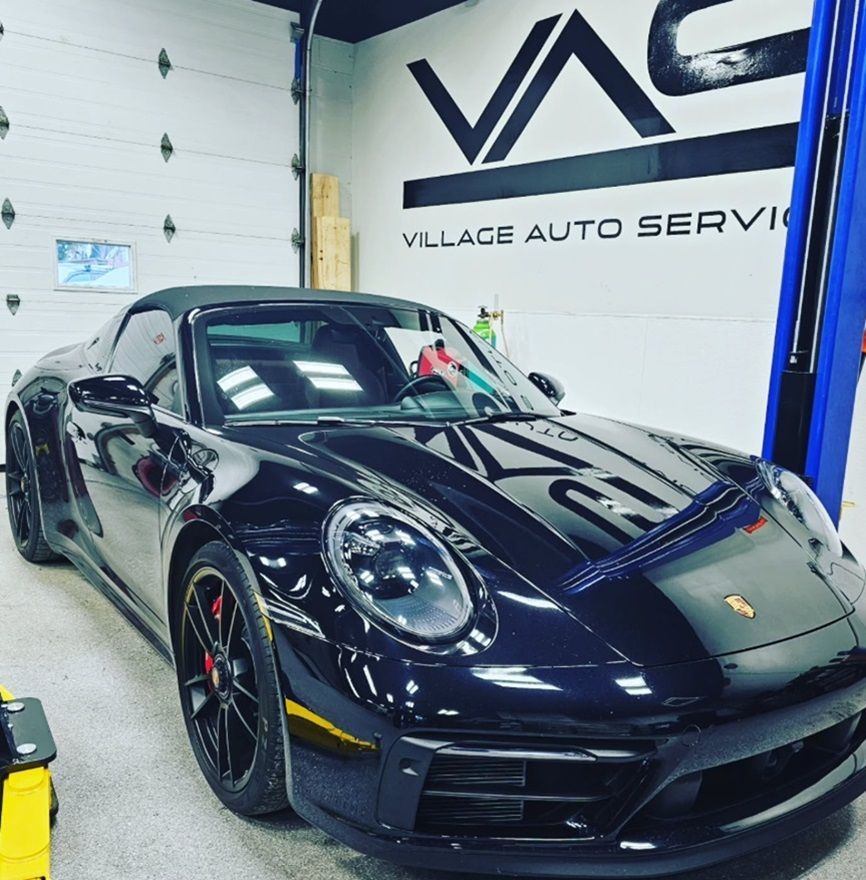 Black Porsche in for maintenance at Village Auto Service