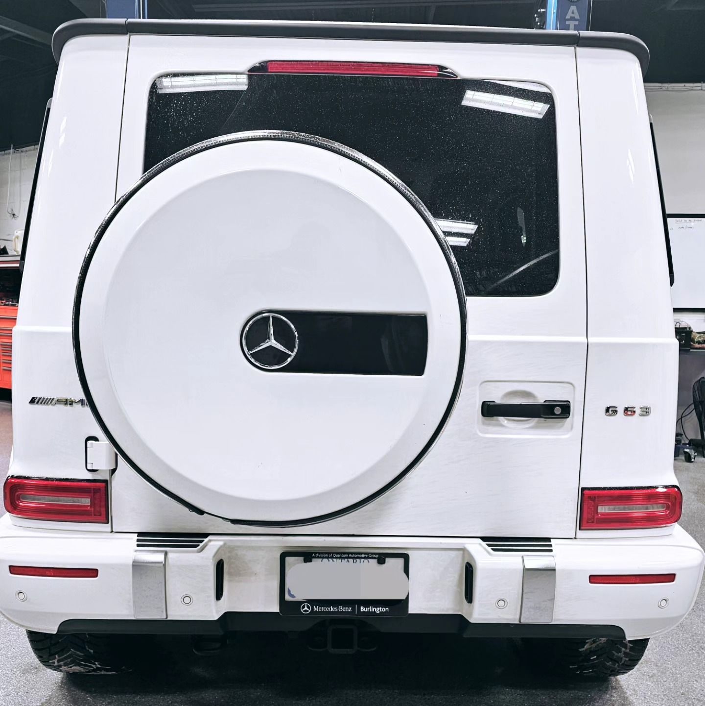 The back of a white Mercedes SUV