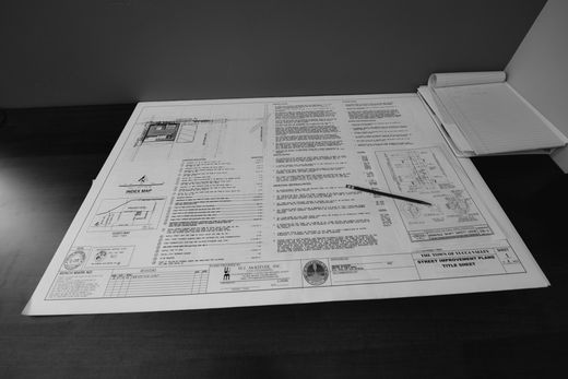 a black and white photo of a drawing on a table