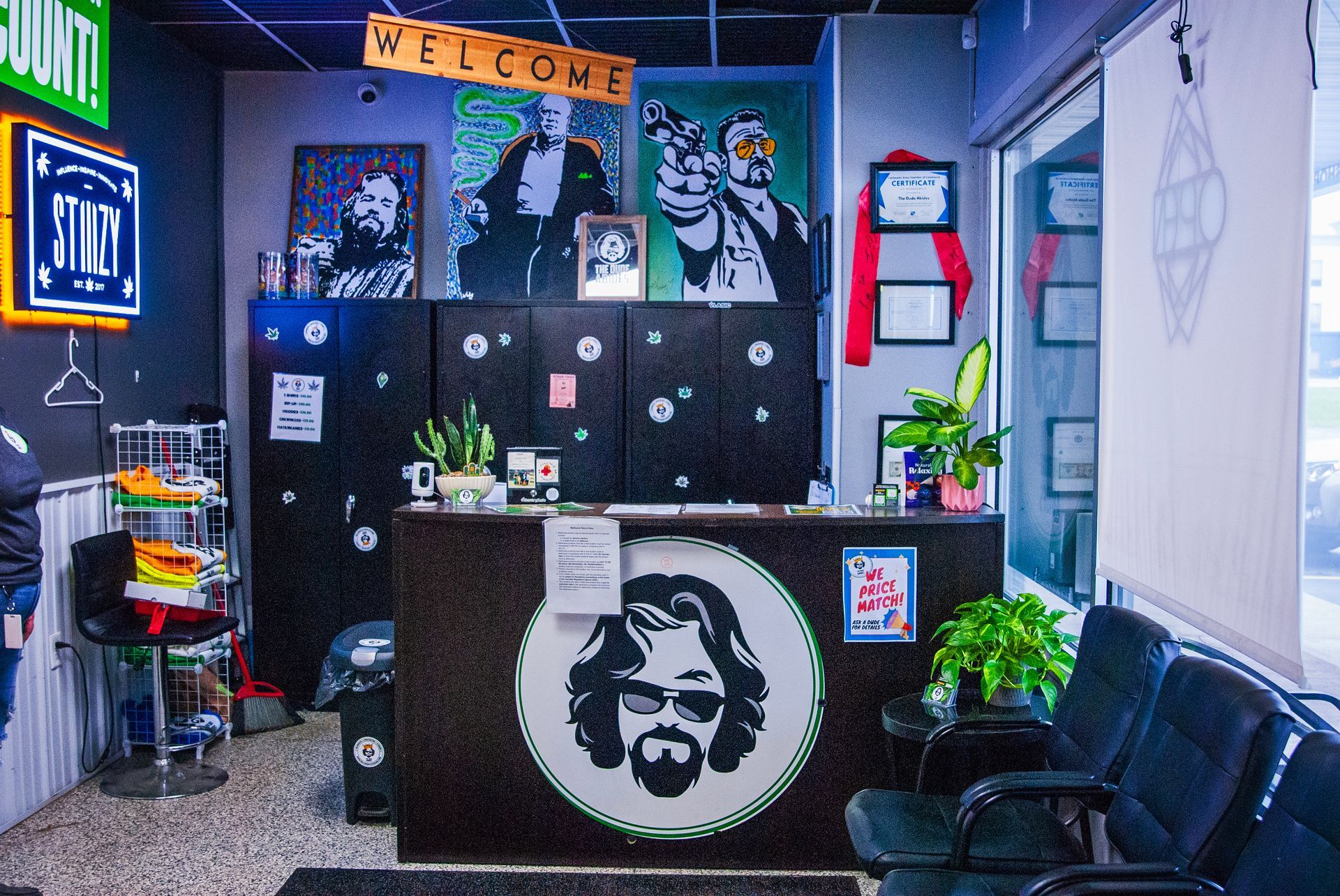 A waiting room with a counter and chairs and a sign that says welcome.