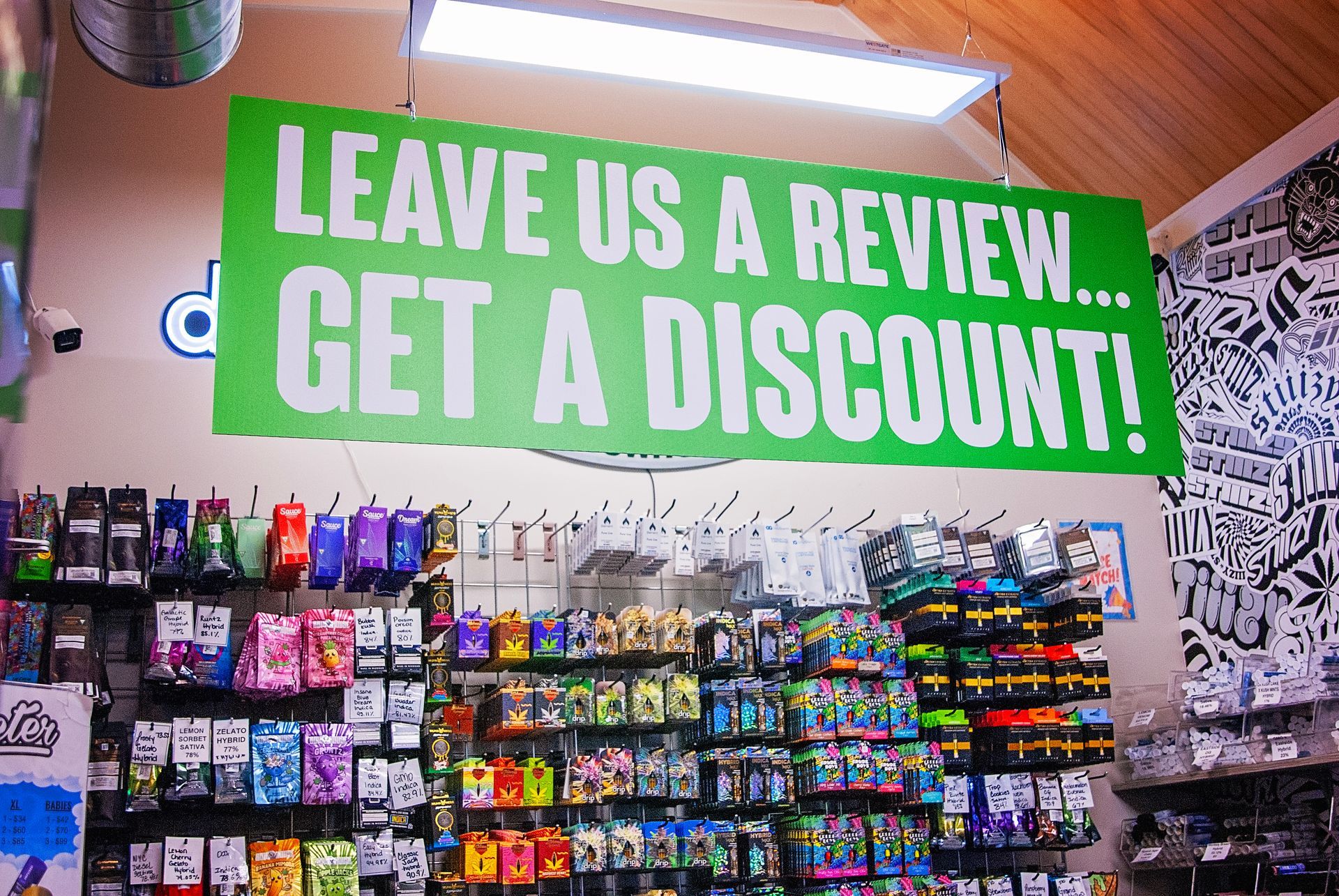 A store with a sign that says leave us a review get a discount