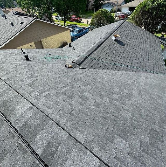 an aerial view of a roof of a house in a residential area .
