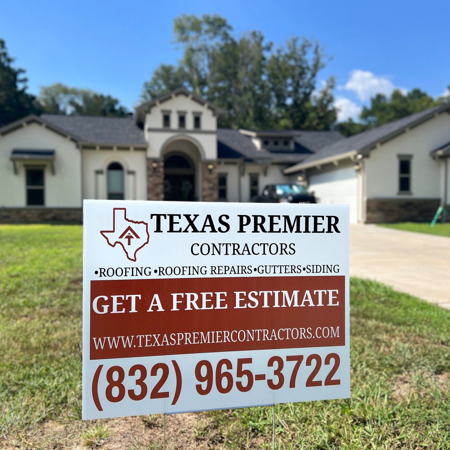 a texas premier contractors sign in front of a house