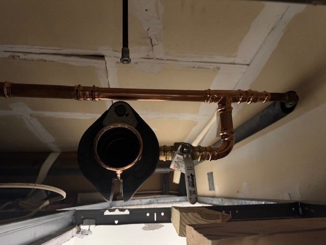 a copper, commercial 3 inch line and fixtures installed on a ceiling by steen & son plumbing and heating