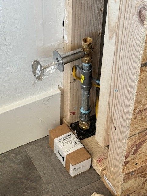a new dante valve for a fireplace sitting between two wooden posts