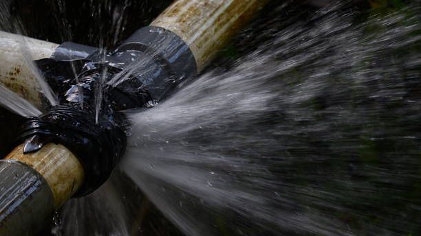 Emergency plumbing, heating, and HVAC service showing water leaking from broken pipe