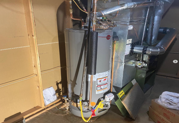 Water heater and furnace in a utility room installed by Steen & Son Plumbing and Heating in Atlantic County, New Jersey