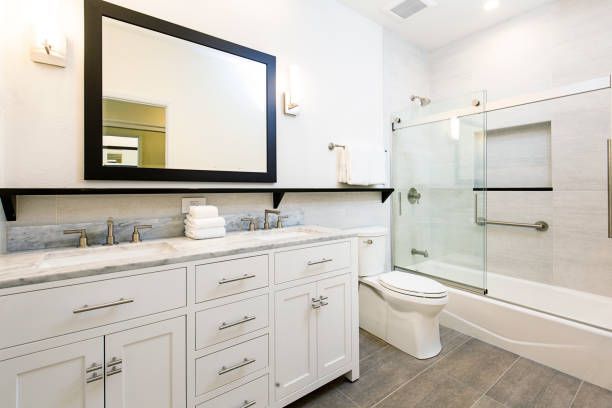 Residential bathroom remodeling with contemporary fixtures and grey-brown hardwood flooring in Mays Landing, NJ