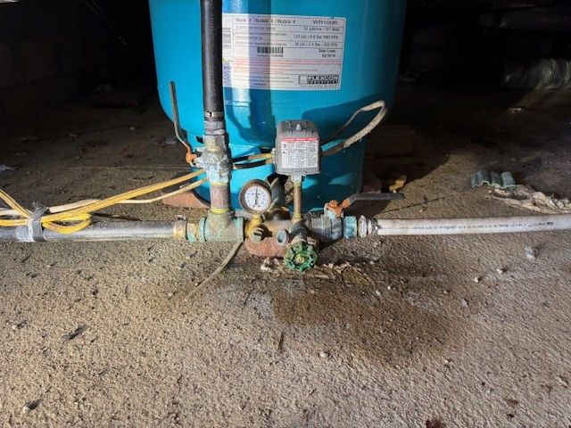 a blue well tank with new t assembly installed by steen & son plumbing and heating in mays landing, new jersey