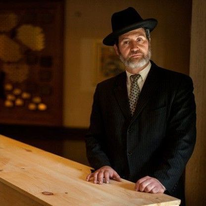 a close up of a person 's hands holding a book