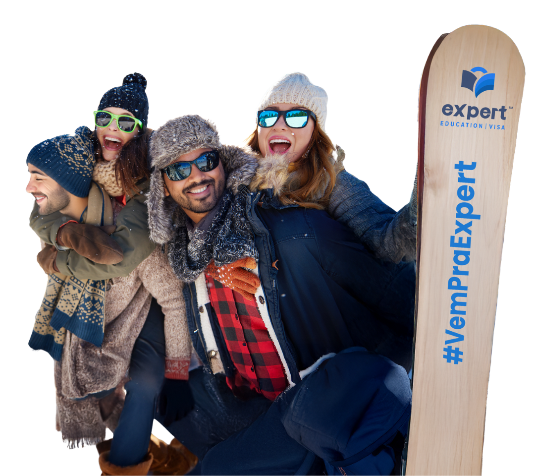 Um grupo de pessoas em pé ao lado de uma prancha de snowboard que diz especialista