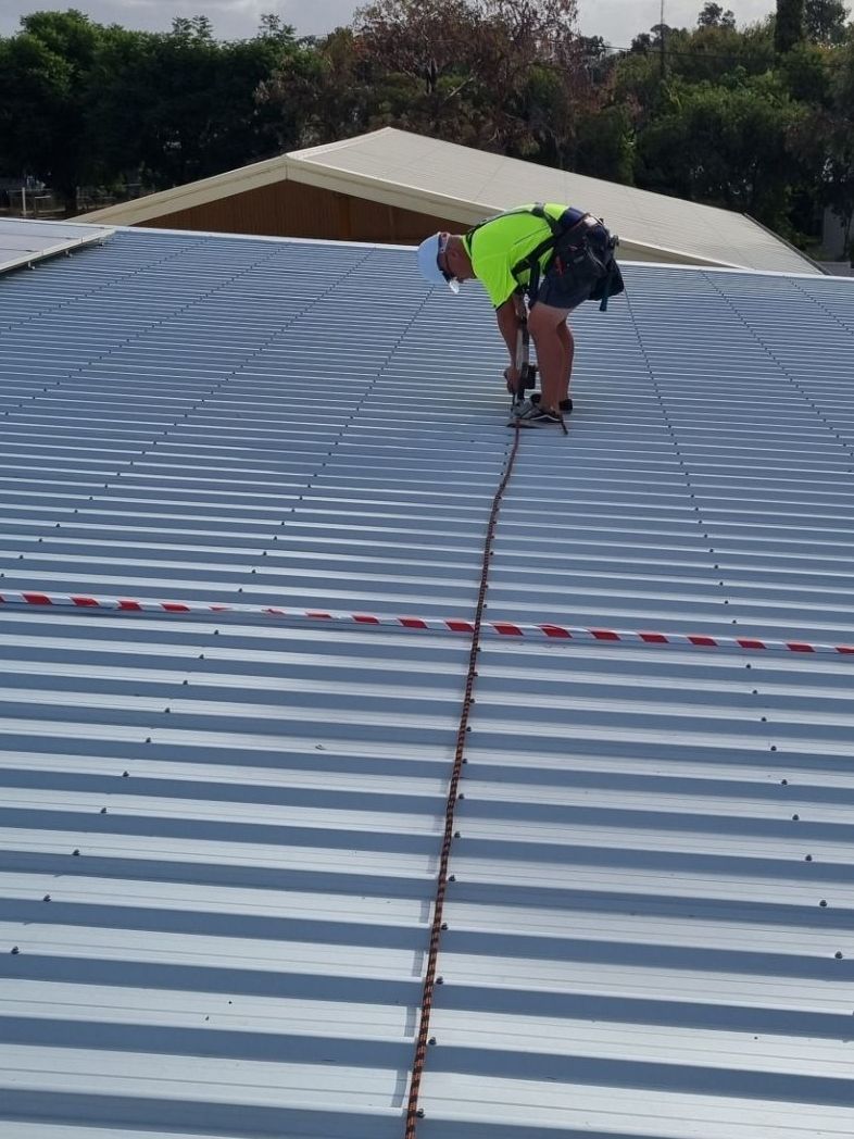 SARG Metal Roof  Work - SARG workers in high-vis working on a home with a new, stylish Colorbond metal roof by SARG