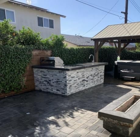 a person is using a drill to install a fence .