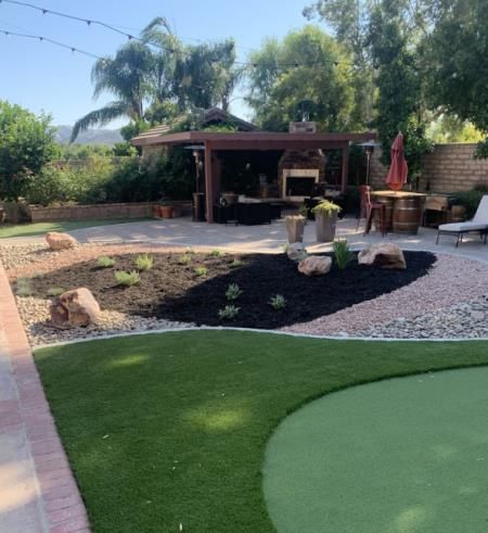 a man is using a drill to drill a hole in a piece of wood .