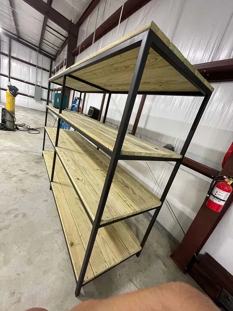 Metal and wood shelving unit in a workshop.