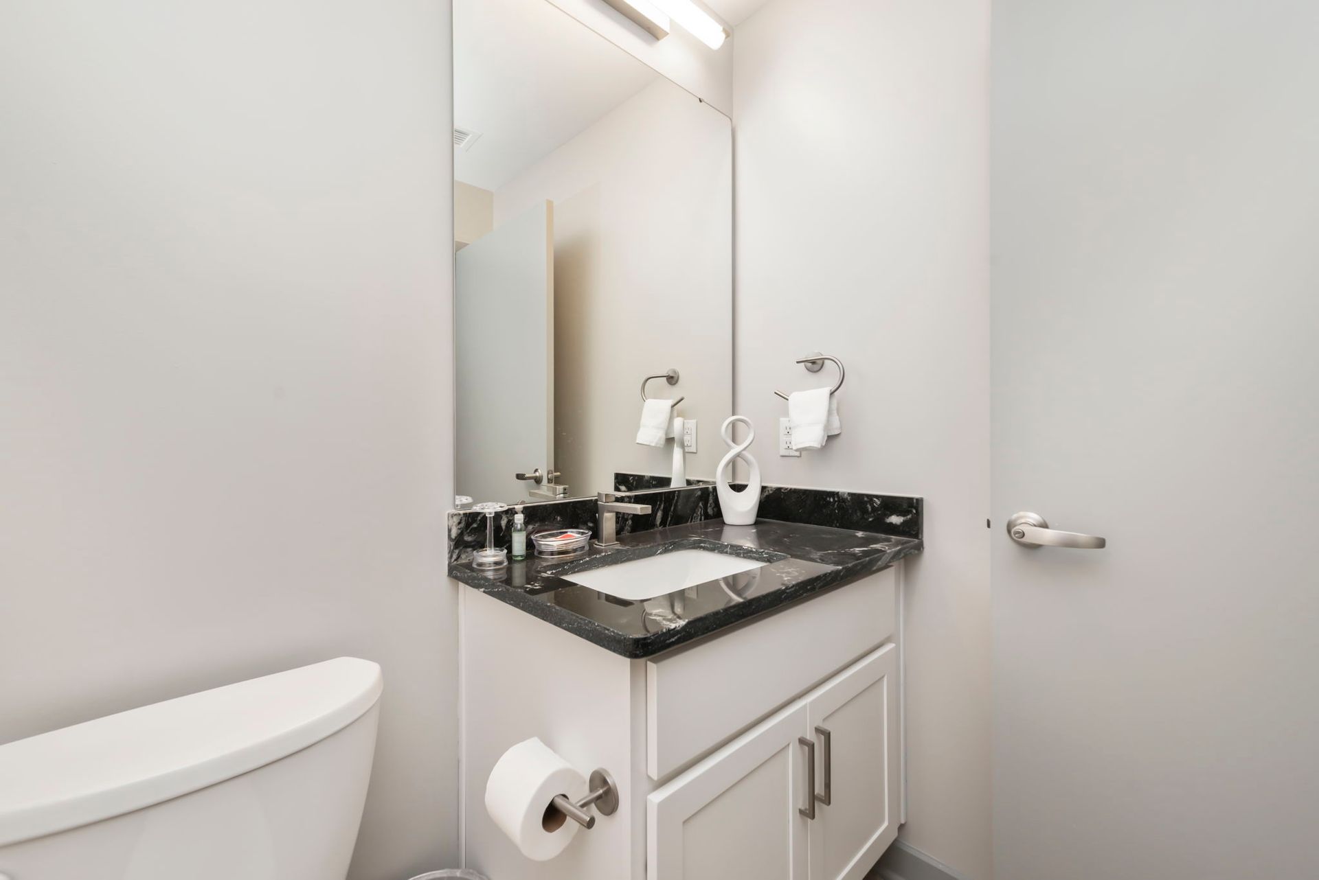 bathroom sink with toilet