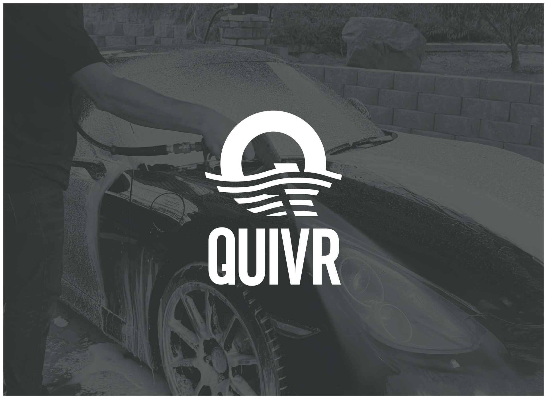 Quivr logo with a person washing a car in the background
