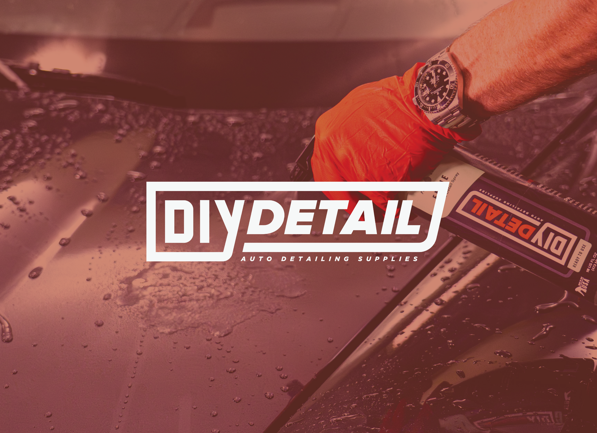 A gloved hand holding a DIY Detail cleaning product over a wet car hood, with a prominent DIY Detail logo overlaid.