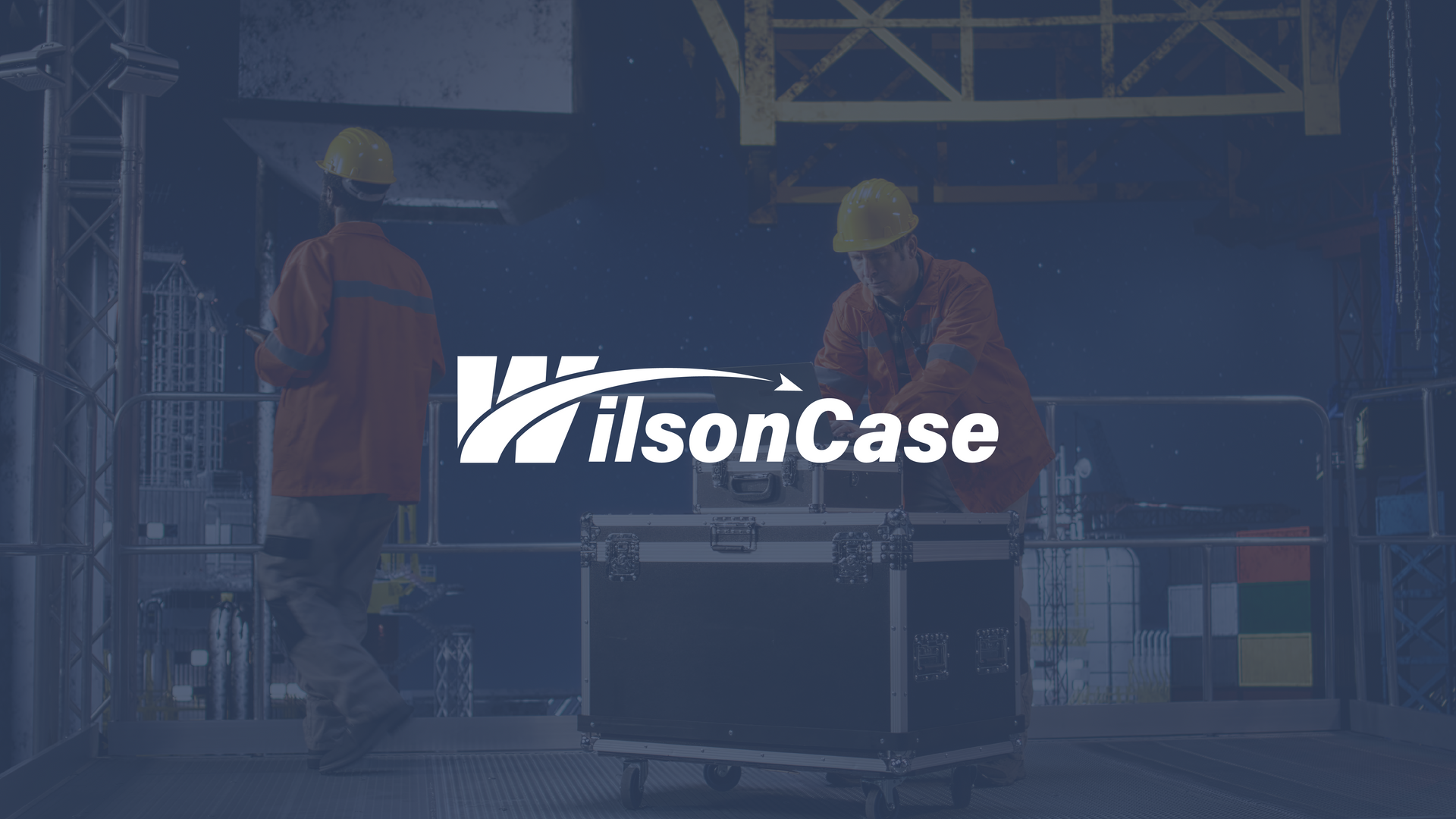 Wilson case logo over an image of men working on hard shipping cases
