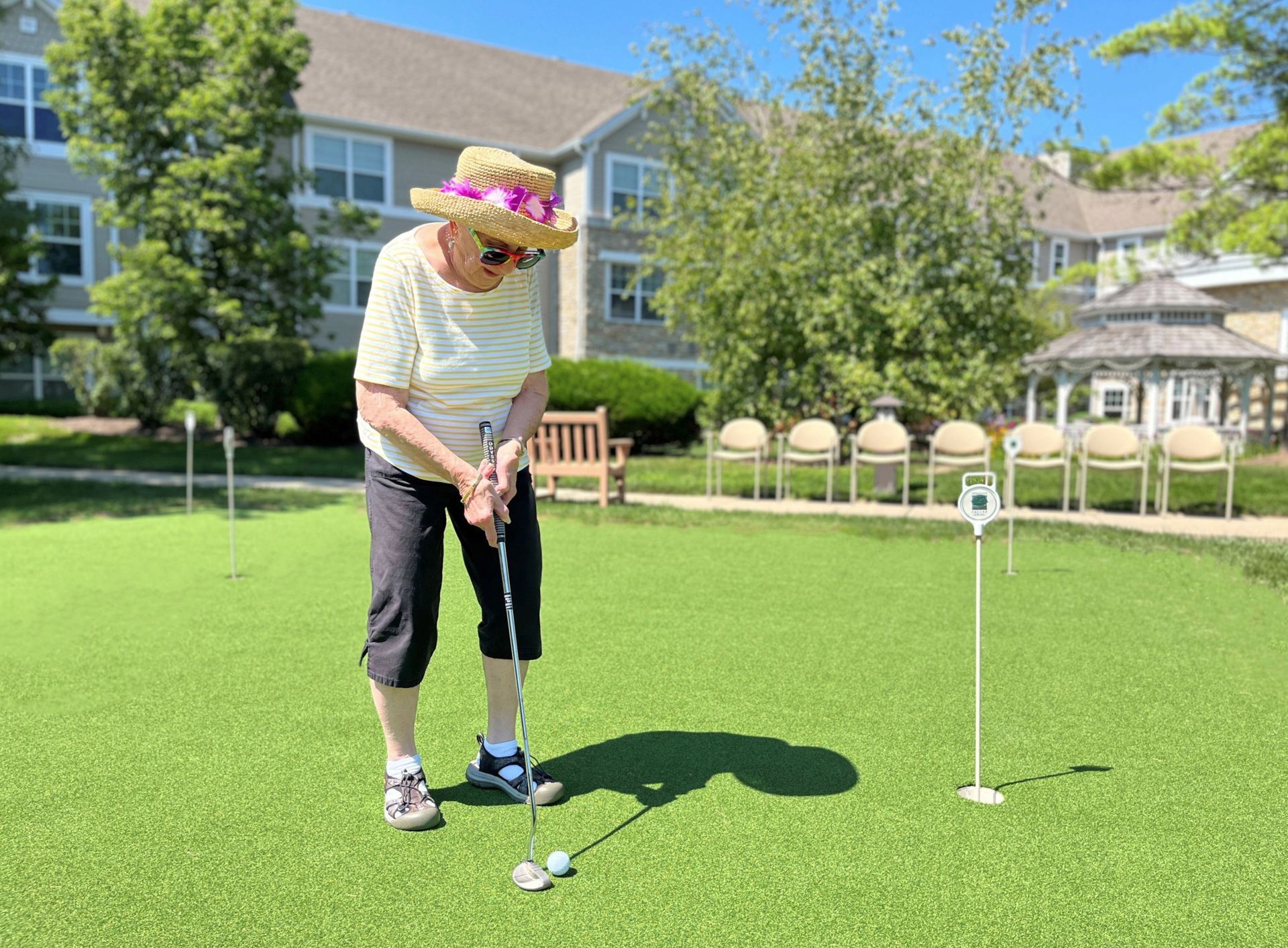 Living Apartments In Illinois — Woman Playing Golf  in Glenview, IL