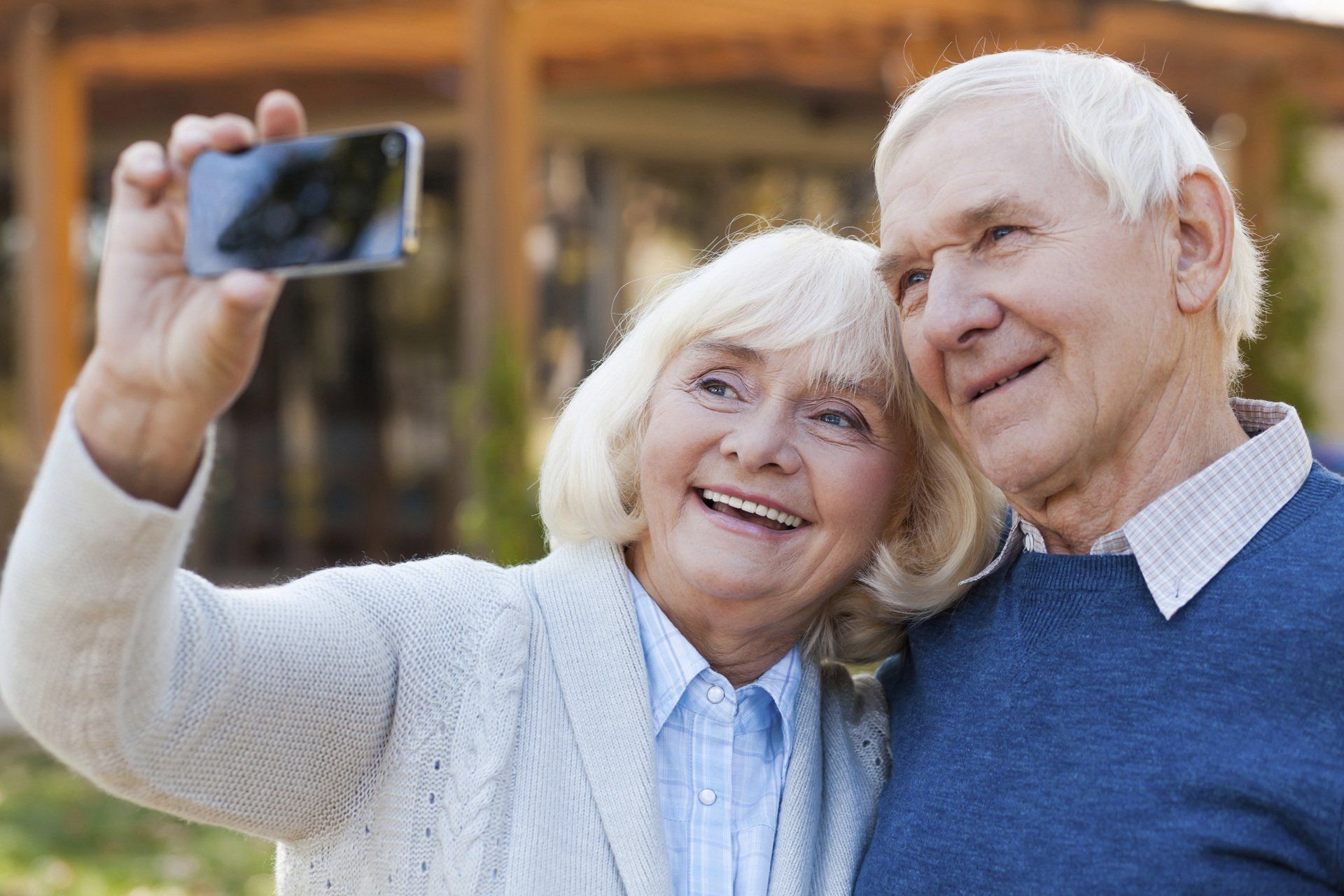 Independent Living — Senior Couple Taking Picture In Park in Glenview, IL