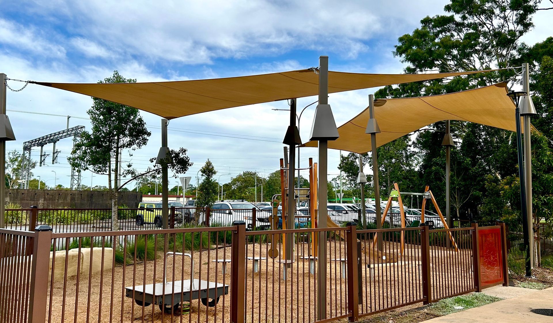 A Group Of Shade Sail Are On Top Of A Lush Green Field — Sunshine Shade & Sails In Woombye, QLD