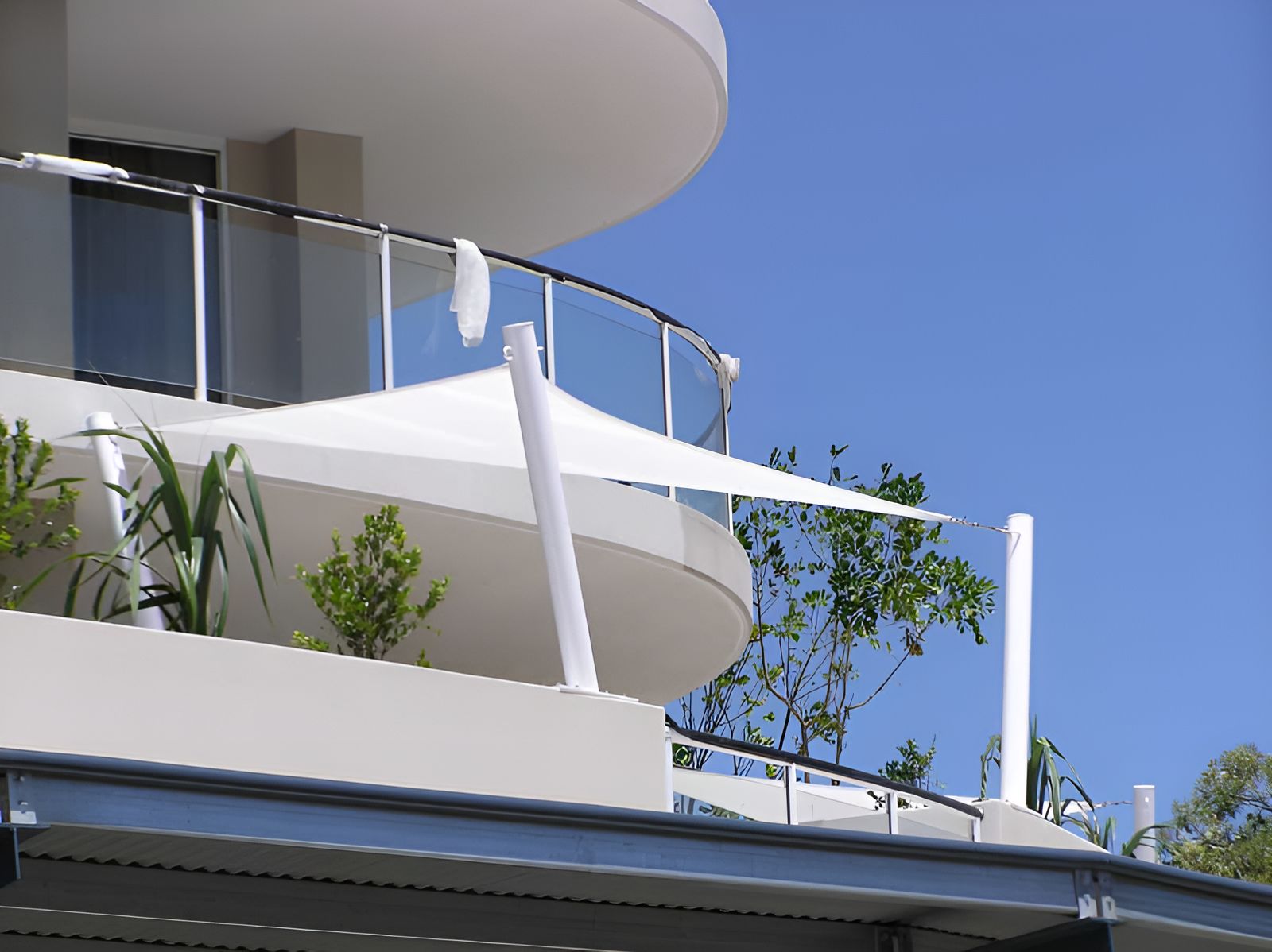 A Balcony With A White Shade Sail On It — Sunshine Shade & Sails In Woombye, QLD