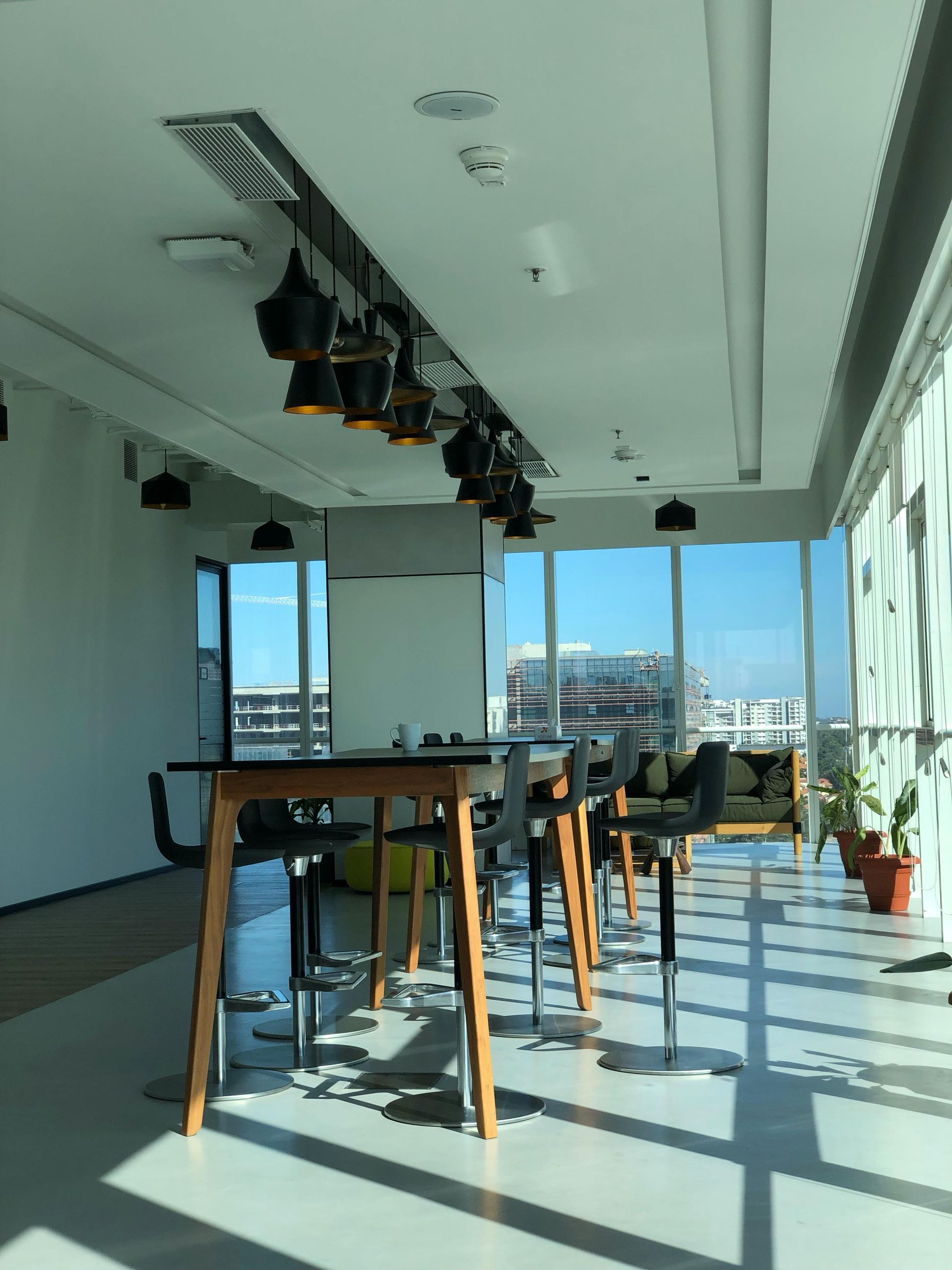 Carpet being cleaned with a carpet cleaner; the area is beige and the machine is visible.