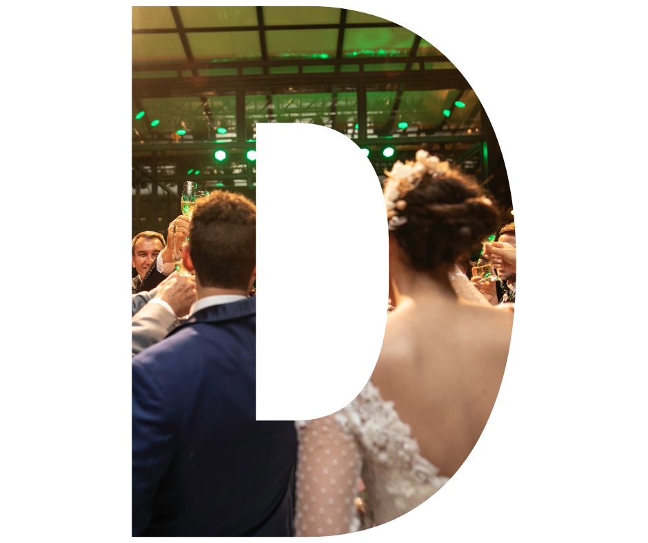 A group of women are posing for a picture in front of a wall of balloons.
