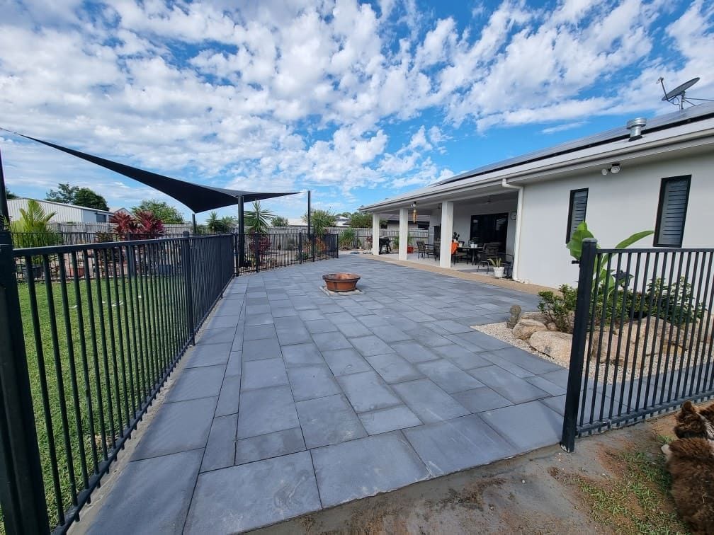 A House With a Fence and a Patio in Front of It — Lynams Landscapes Pty Ltd in Mount Louisa, QLD