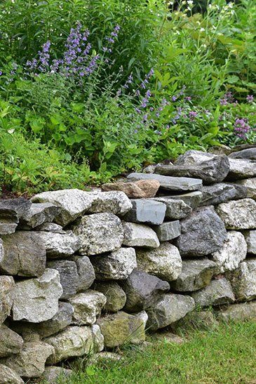 Stone Wall In Garden — Lynams Landscapes In Jensen QLD