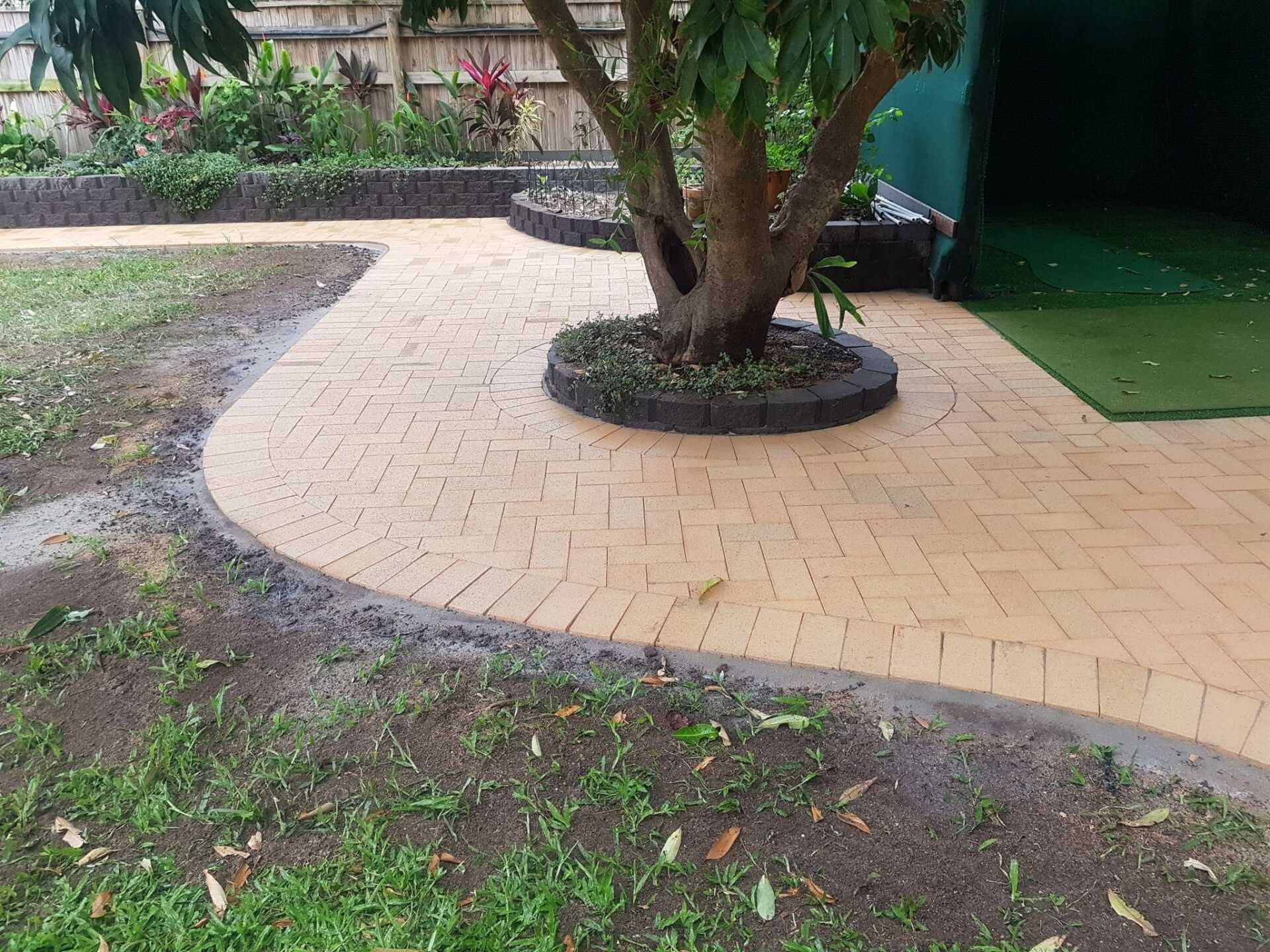 Laying Gray Concrete Paving Slabs — Lynams Landscapes In Jensen QLD