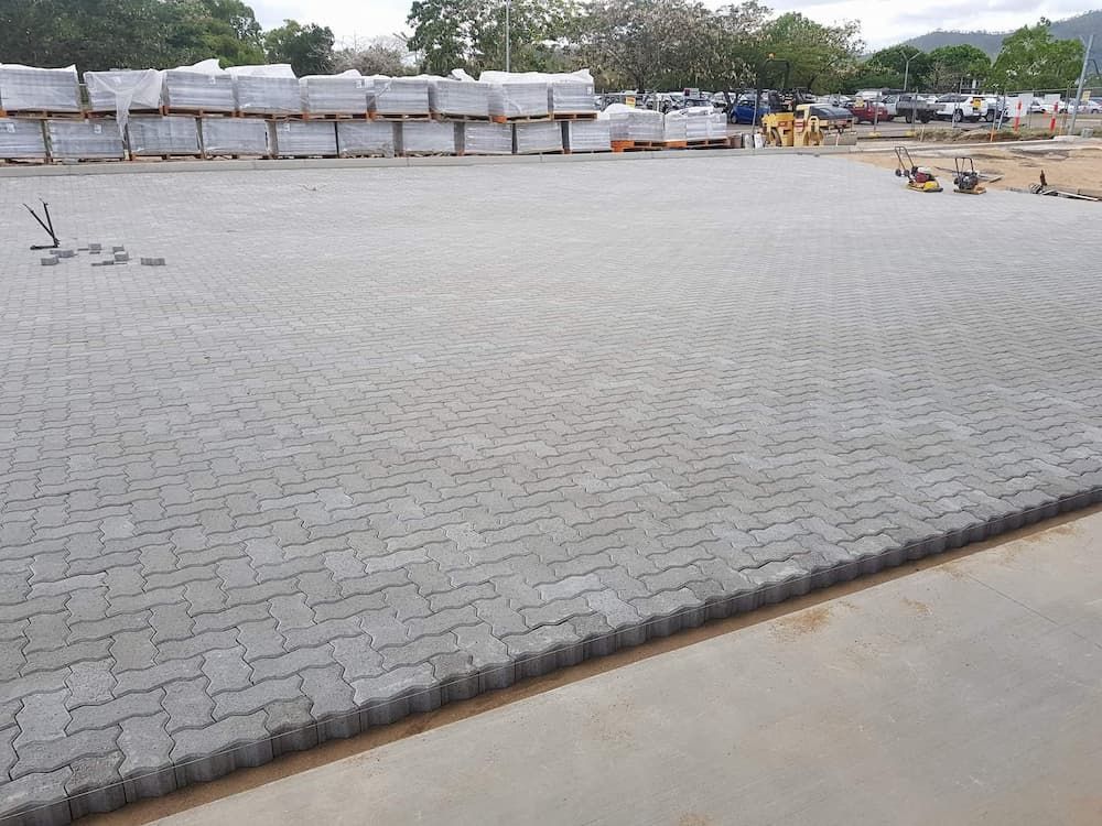 A Large Brick Pavement is Being Built in a Parking Lot — Lynams Landscapes Pty Ltd in Jensen, QLD
