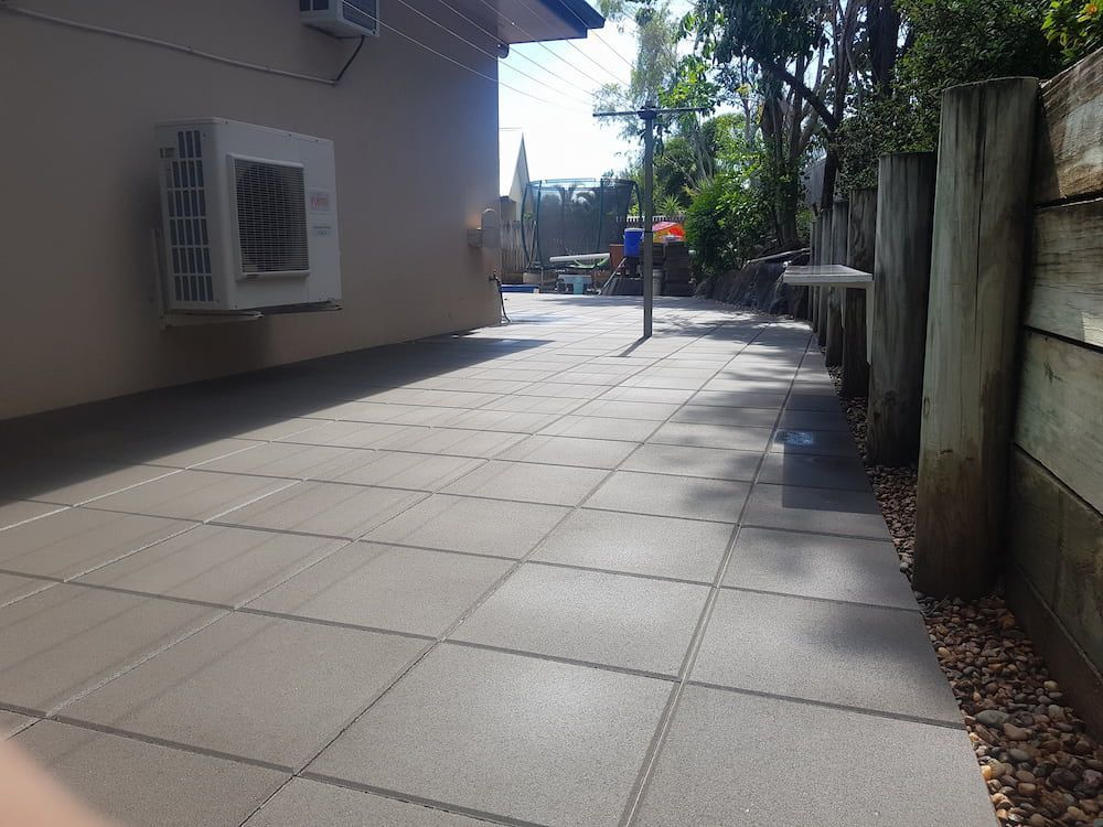 A Patio With a Fan on the Side of a Building — Lynams Landscapes Pty Ltd in Jensen, QLD