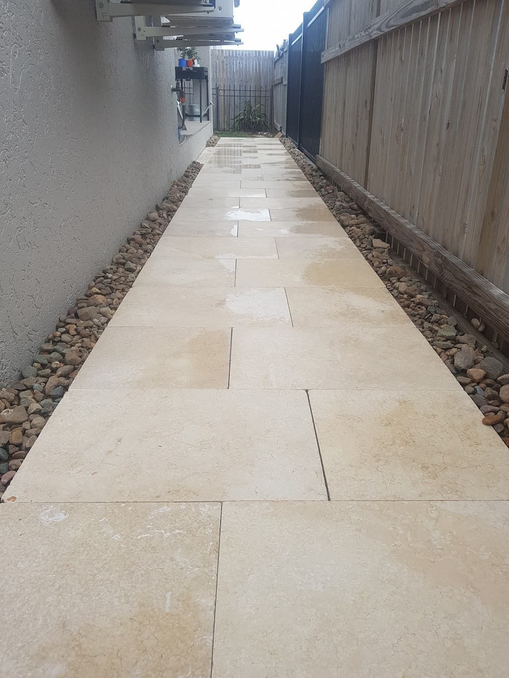 A Sidewalk Leading to a Fence With a Fence in the Background — Lynams Landscapes Pty Ltd in Jensen, QLD