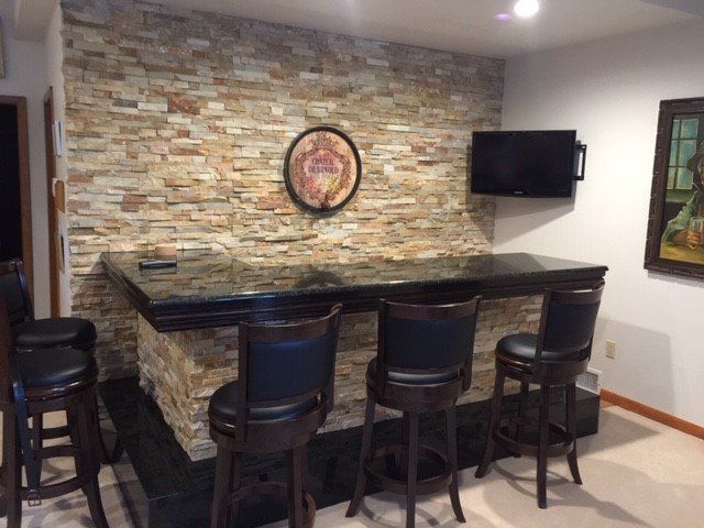Dining Room with Brick Wall — Greensburg, PA — Ruggiero Kitchen, Bath & Flooring Design Studio