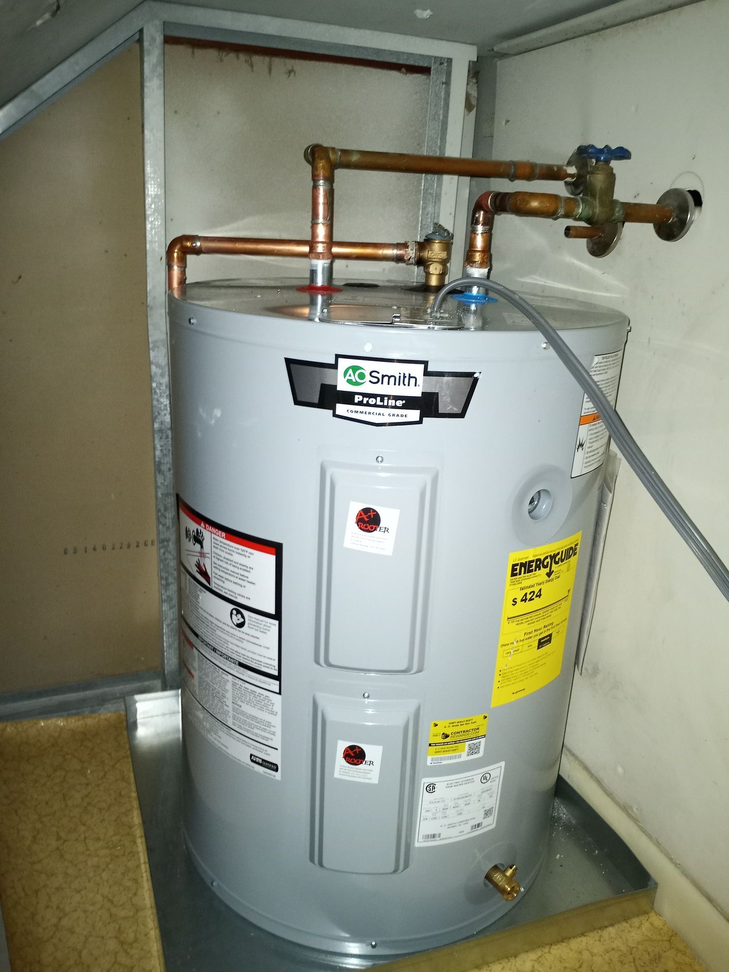 a water heater is sitting in a corner of a room