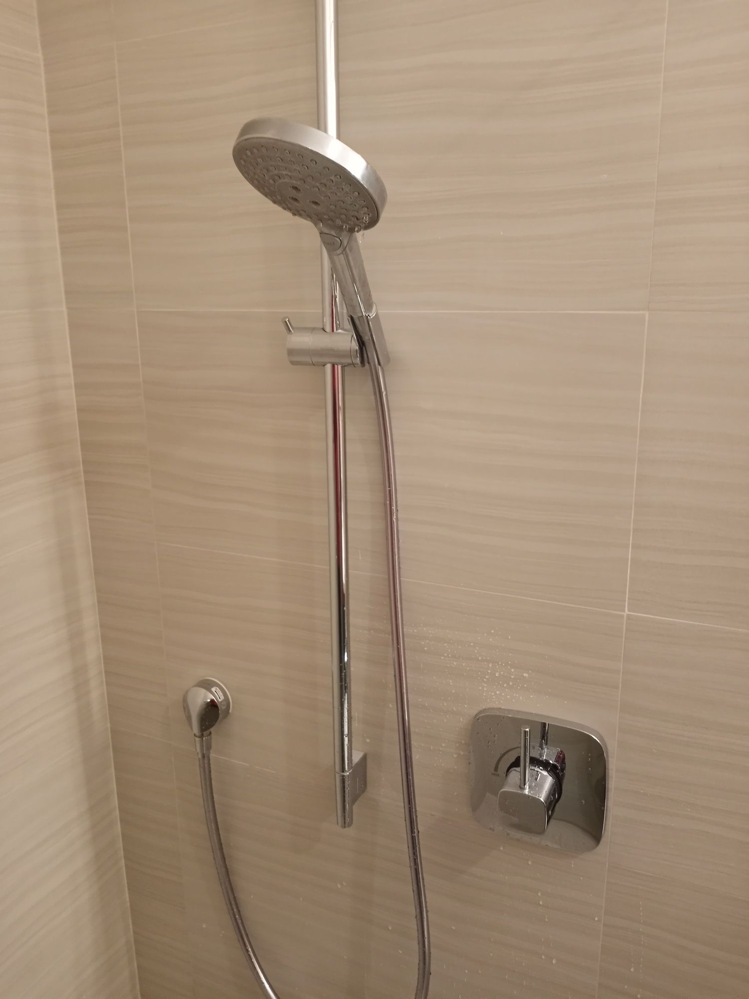 a close up of a shower head in a bathroom .