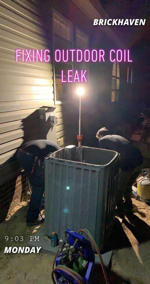 The team are fixing an outdoor coil leak