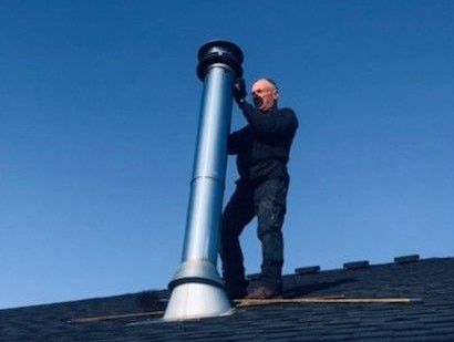 Chimney Sweep Working On Ladder - Springfield, MO - Flue Dr Chimney Service Chimney Sweep Working On Ladder - Springfield, MO - Flue Dr Chimney Service