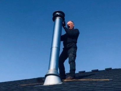 Chimney Sweep Working On Ladder - Springfield, MO - Flue Dr Chimney Service