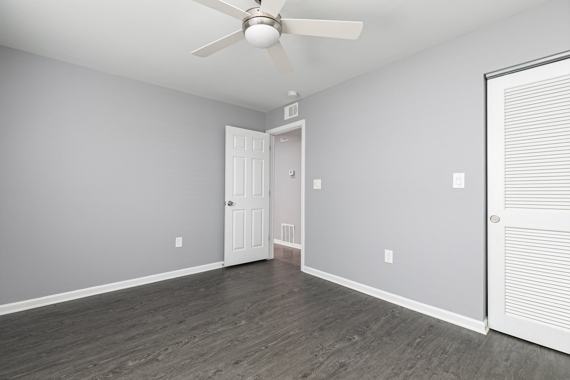 Gardens at Park West Bedroom with Hardwood floors