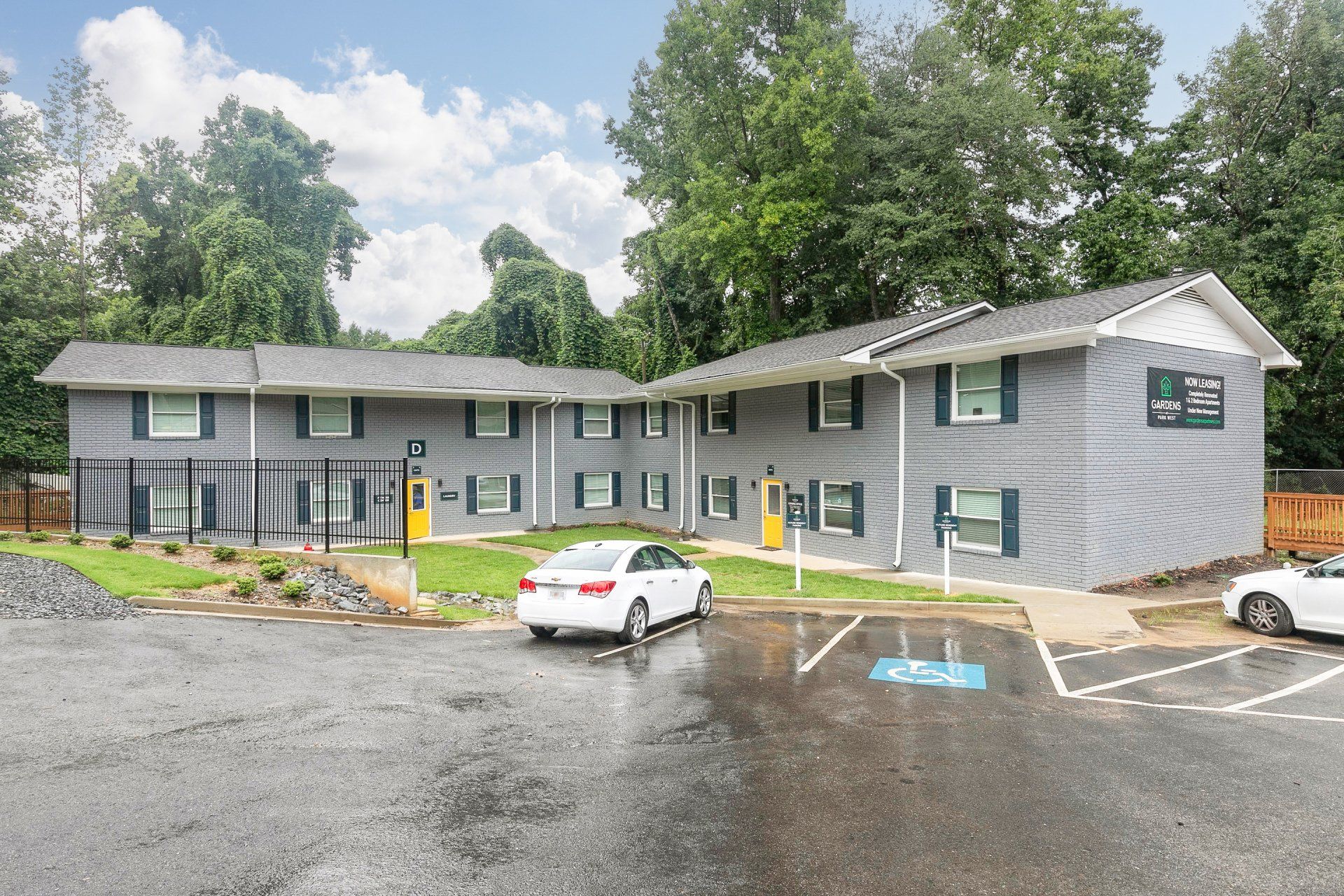 Forest Park, GA Apartments - Gardens at Park West - Parking Lot In Front Of Apartments.