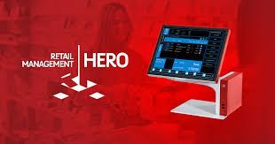 A computer monitor is sitting on a stand on a red background.