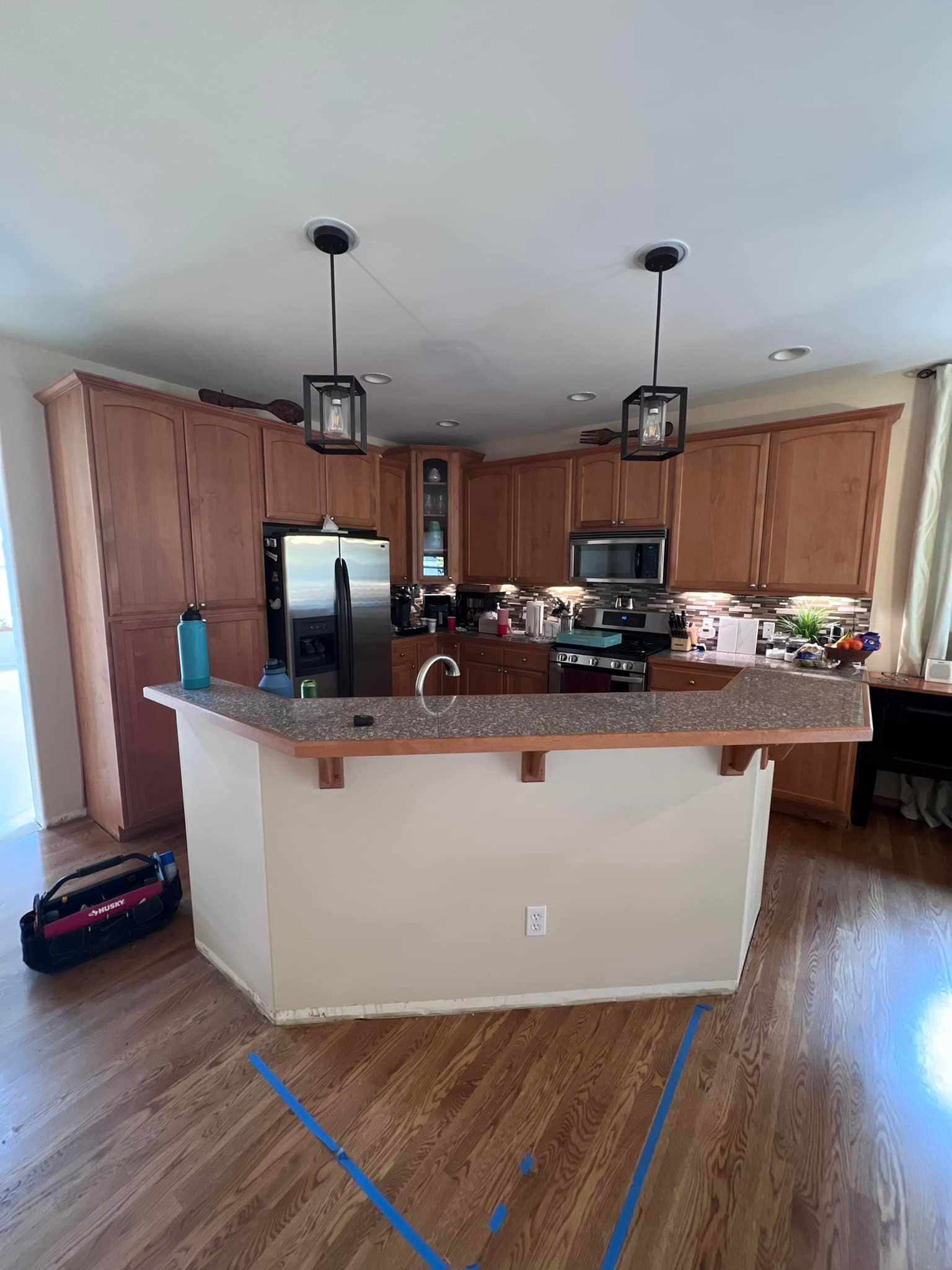 A kitchen with a large island in the middle of the room.