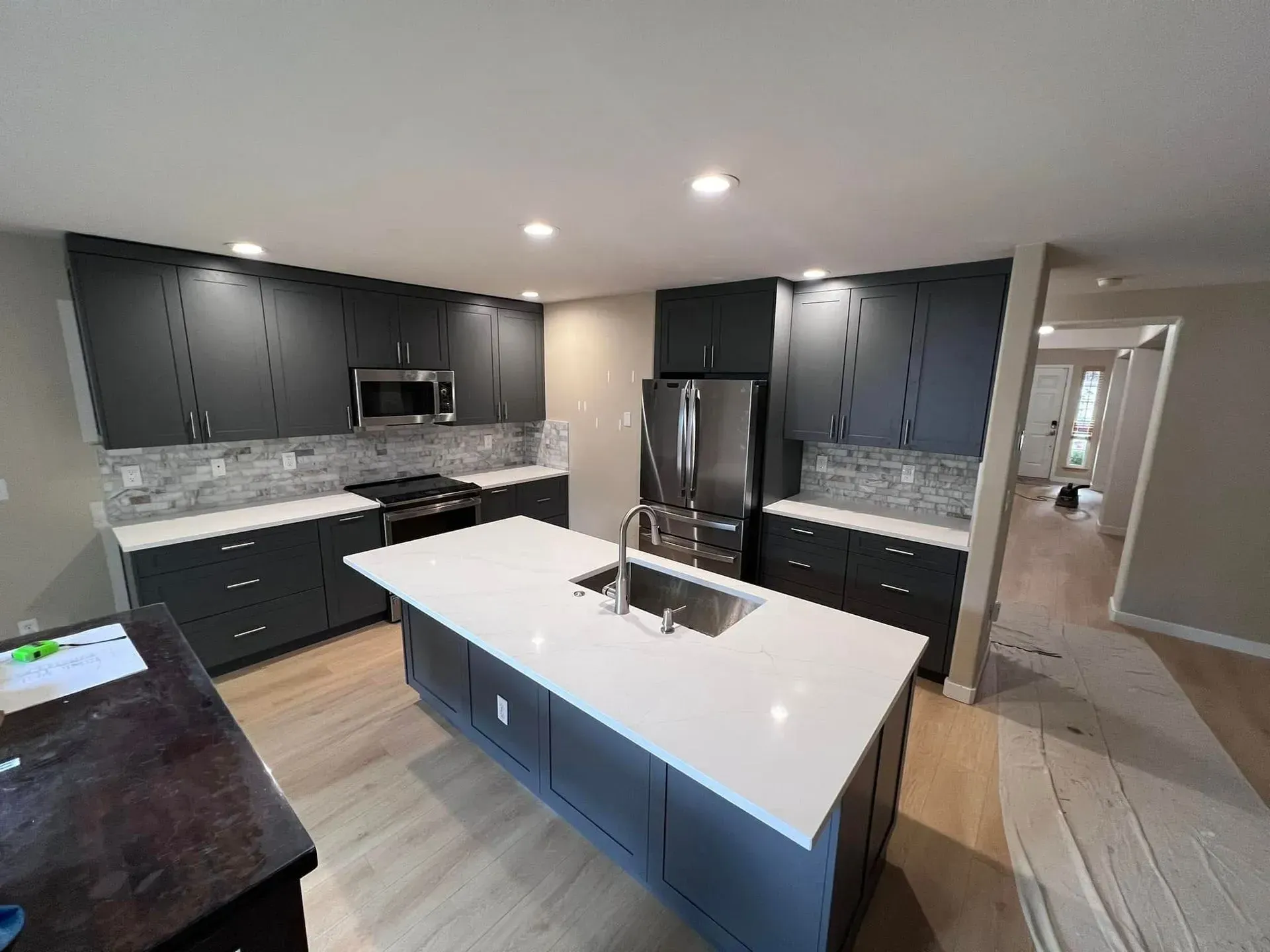 A kitchen with a large island in the middle of it.